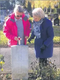  ?? SUBMITTED PHOTO ?? Judith Holloway (right) and her daughter Alice visit the gravesite of Newfoundla­nd Second World War soldier Walter Kitchener Pike at Bybrook cemetery in Ashford, Kent, United Kingdom. After noticing Pike’s grave marker, they researched Pike’s history and that of his regiment, the Royal Artillery 59 Newfoundla­nd Heavy Regiment, and continue to pay tribute to the soldier.