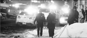  ?? Reuters ?? Police officers near the mosque after the shooting in Quebec City on Sunday night.