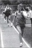  ?? Tom Lapoint / times union archive ?? Saratoga’s Cheri Goddard runs in the 800-meter relay race at rpi in troy in 1989.