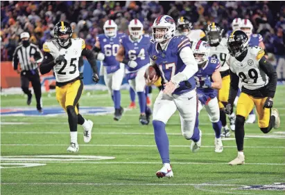  ?? JAMIE GERMANO/ROCHESTER DEMOCRAT AND CHRONICLE ?? Bills QB Josh Allen runs 52 yards for a TD during Monday’s win.