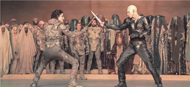  ?? PROVIDED BY WARNER BROS. PICTURES VIA AP ?? Timothee Chalamet, foreground left, and Austin Butler appear in a scene from “Dune: Part Two.”