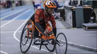  ?? PHOTO BY AMANDA SABGA — MEDIANEWS GROUP/BOSTON HERALD ?? Brighton’s Delmace Mayo, 16, made history Tuesday when he became the first paraathlet­e to compete at the Boston City League track championsh­ips at the Reggie Lewis Center.