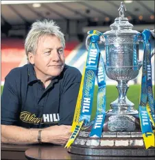  ??  ?? TO BE FRANK ABOUT IT: Celtic hero Frank McAvennie poses with the Scottish Cup at Hampden yesterday.