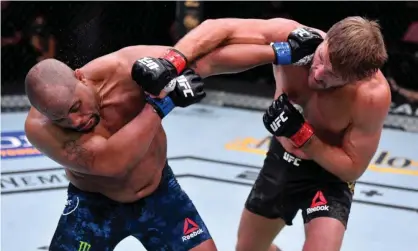  ?? Photograph: Jeff Bottari/Zuffa LLC ?? Stipe Miocic punches Daniel Cormier during their UFC heavyweigh­t title bout at UFC 252.