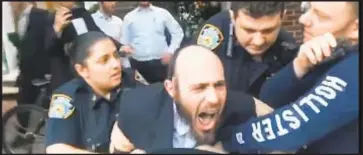  ??  ?? Some in angry Brooklyn crowd chant “Nazis!” as Joel Herskovitz (above) is arrested in Borough Park.