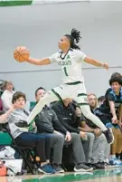  ?? TERRANCE WILLIAMS/FOR BALTIMORE SUN MEDIA ?? Arundel’s Noah Frayer attempts to save the ball from going out of bounds during the first half Friday against South River.