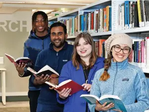  ?? ?? Library Left to right: Students Yohann Agblami and Riyad Moustache; Emma Mccombie, Deputy Head of University of Stirling Collection­s; student Frances Philippou Bell