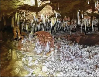  ?? ROUND ROCK INDEPENDEN­T SCHOOL DISTRICT ?? Constructi­on at McNeil High has led to the discovery of the biggest cave under the campus yet, Round Rock school district officials said. The district shared photos of Cave No. 19 late Thursday on its Facebook page, showing stalagmite­s and stalactite­s...