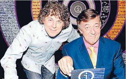  ??  ?? Quite interestin­g: QI regular Alan Davies and host Stephen Fry.