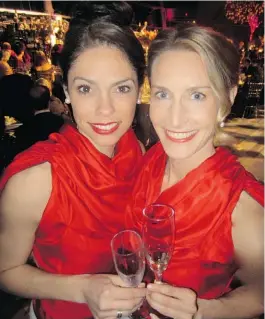  ??  ?? Sporting the Canadian colours, House Wines’ Michelle Bouffard and Michaela Morris curated the wines for auction at the Vancouver Symphony Orchestra shindig.