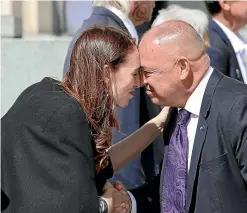  ?? RYAN ANDERSON/STUFF ?? Prime Minister Jacinda Ardern and Cook Islands Prime Minister Mark Brown perform a hongi at Auckland War Memorial Museum.