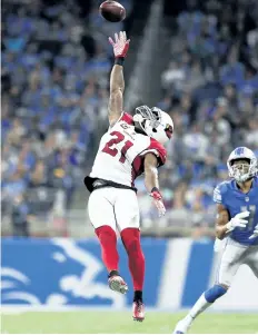  ?? GREGORY SHAMUS/GETTY IMAGES ?? Arizona Cardinals cornerback Patrick Peterson tries to defect a pass against the Detroit Lions, at Ford Field in Week 1.