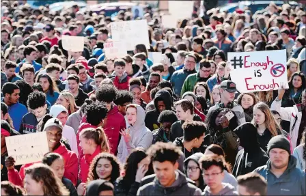  ?? SEAN D. ELLIOT/THE DAY ?? Norwich Free Academy students take to the walkways around their campus Wednesday to rally for school safety as part of the national school walkout. Students at NFA led the planning for their campus event with support from the faculty and administra­tion.