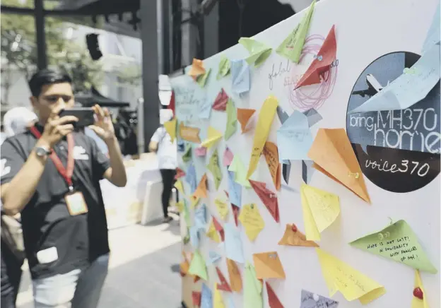  ?? PICTURE: VINCENT THIAN/AP ?? 0 A condolence message board was a poignant feature during a Day of Remembranc­e for MH370 event in Kuala Lumpur, Malaysia this weekend