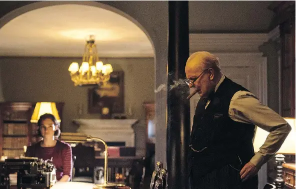  ?? — FOCUS FEATURES FILES ?? Lily James, left, and Gary Oldman star in Darkest Hour, which is now available for purchase, but not to rent.