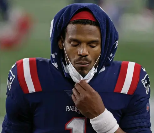  ?? MATT STONE / HERALD STAFF ?? DOZE NOT? Patriots quarterbac­k Cam Newton stands on the sideline after being taken out of Monday night’s loss to Buffalo. More may be feeling as sleep-challenged as Newton these days, and analysts warn that’s not a good thing.