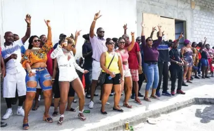  ?? GEMMA HANDY/AFP ?? Revellers dance during the World Music Creole Festival on October 28 in Roseau, Dominica.