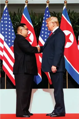  ??  ?? The last nuclear test by North Korea was conducted in September 2017.The regime also launched an interconti­nental ballistic missile in November 2017.Pyongyang is expected to demand ‘correspond­ing measures’ including the lifting of US sanctions. North Korean leader KimJong Un and US President Donald Trump shake hands prior to their meeting on Sentosa Island in Singapore. AP/File