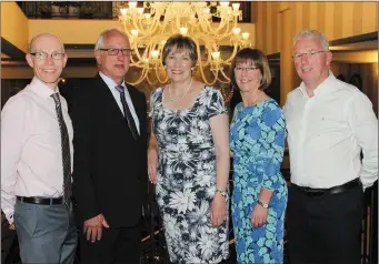  ??  ?? Vincent Browne and Lucy Power are congratula­ted on their retirement by school principal Michael Finn (left) and deputy principals Stella Kehoe and Frank Duke.