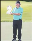  ?? (AFP) ?? William McGirt poses with the trophy after winning The Memorial Tournament at Muirfield Village Golf Club
on June 5, in Dublin, Ohio.