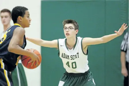  ?? CLIFFORD SKARSTEDT/EXAMINER ?? Adam Scott Lions' Keegan Whitney pressures St. Benedict's Terrell Webb during NIT Division A semifinal action at Kawartha Classic Junior Boys Basketball Tournament on Feb. 6, 2016 at Adam Scott gymnasium. This year's Kawartha Classic Madness Tournament...