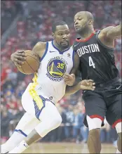  ??  ?? Kevin Durant, who had 29points, heads to the basket against PJ Tucker in the first quarter.