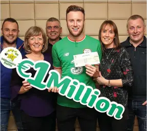  ?? PA ?? Cheque it out: Kevin O’Connor and family with his ¤1m prize