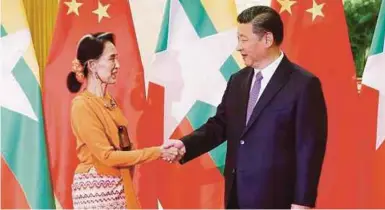  ?? REUTERS PIC ?? Aung San Suu Kyi with Chinese President Xi Jinping at a Beijing summit this month.