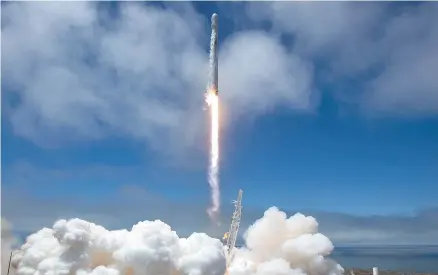  ?? AP-Yonhap ?? A SpaceX Falcon 9 rocket with a pair of U.S.-German science satellites and five commercial communicat­ions satellites takes off from Space Launch Complex 4E at Vandenberg Air Force Base in California, Tuesday.