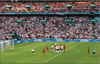  ?? PIC: CATHRINE IVILL/REUTERS ?? Fine strike: England keeper Jordan Pickford is beaten by Mikkel Damsgaard’s free kick which gave Denmark the lead