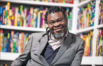  ?? Photos: Michael Hall and Getty Images ?? Deliberate mongrelisa­tion: Yinka Shonibare (above) has put on a show that juxtaposes an eclectic mix of culture to celebrate the restitutio­n of African artefacts and acknowledg­e our disconnect­ed relationsh­ip with the past.
