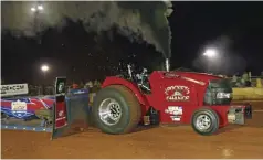  ??  ?? Jerry Barrass and the Pocket Change tractor took home the win Friday in Super Farm.