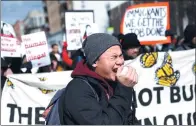  ?? AARON P. BERNSTEIN / REUTERS ?? Demonstrat­ors march in a ‘Day Without Immigrants’ protest in Washington on Thursday.