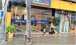  ??  ?? One of the city’s busiest streets, Stanley Road, was inundated as its drainage canals were partially or fully damaged by traders, or illegal new buildings. Pix by N.Lohathayal­an