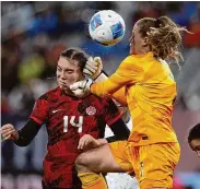  ?? Harry How/Getty Images ?? The United States’ Alyssa Naeher makes a save against Canada’s Vanessa Gilles (14) in extra time during the Gold Cup semifinals at Snapdragon Stadium on Wednesday in San Diego.