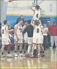  ?? ?? The Upper Lake Cougars celebrate their championsh­ip win over Mendocino on Saturday night at the Potter Valley Tournament.