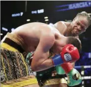  ?? FRANK FRANKLIN II — THE ASSOCIATED PRESS ?? Shawn Porter, right, punches Danny Garcia during the seventh round of a WBC welterweig­ht championsh­ip boxing match, Saturday in New York. Porter won the fight.