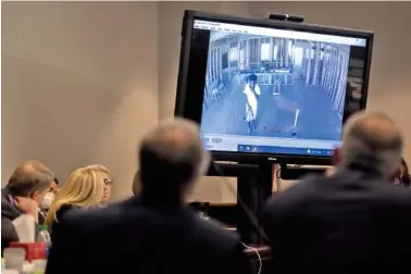  ?? AP PHOTO/STEPHEN B. MORTON, POOL ?? Prosecutor Linda Dunikoski shows a video of Ahmaud Arbery walking through a house under constructi­on during the trial of Greg McMichael and his son, Travis McMichael, and a neighbor, William “Roddie” Bryan in the Glynn County Courthouse last Tuesday in Brunswick, Ga.