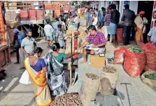  ?? Photo: Manivasaga­n N ?? Social distancing is not followed at Koyambedu market and masks are also not worn properly