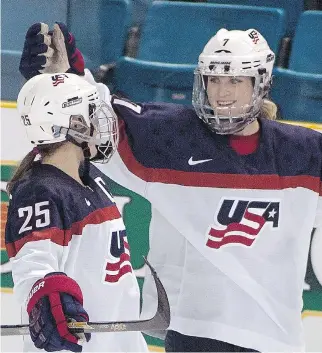  ?? JEFF BASSETT/THE CANADIAN PRESS/FILES ?? Monique Lamoureux, right, and other members of the United States’ national women’s hockey team tweeted a statement Wednesday, stating they won’t participat­e in the upcoming women’s world championsh­ips in Michigan unless progress is made on “fair wages and equitable support.”