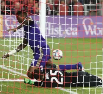  ?? STEVE RUSSELL/TORONTO STAR ?? Toronto FC goalkeeper Alex Bono denies Orlando’s Cyle Larin from close range in the second half at BMO Field.