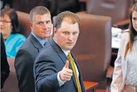  ??  ?? Rep. Jon Echols signals a “thumbs up” to a fellow lawmaker as members vote on a procedural matter in 2016. Lawmakers in the House and Senate passed a bill Echols wrote that would reduce fees on charter schools. [THE OKLAHOMAN ARCHIVES]