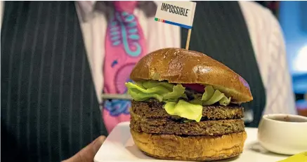  ??  ?? Air New Zealand is giving customers a taste of the future with its inflight plant-based burger.
