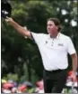  ?? SADIQ ASYRAF — THE ASSOCIATED PRESS FILE ?? Pat Perez acknowledg­es the crowd on the 18th hole after winning the CIMB Classic golf tournament at Tournament Players Club (TPC) in Kuala Lumpur, Malaysia.