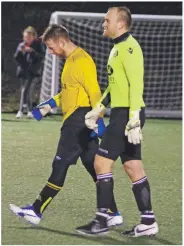  ??  ?? The two goalkeeper­s - Ben Pollock and Thomas McCulloch head towards the Dalintart end goal for the penalty shoot-out.