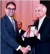  ??  ?? Rocell Director Marketing and Business Developmen­t Tharana Thoradeniy­a accepts the award from Prime Minister Ranil Wickremesi­nghe