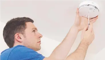  ??  ?? DON’T SKIMP: Installing a smoke alarm is important in any investment property.