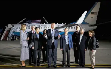  ??  ?? Sigh of relief: Trump speaking to members of the media with the detainees – Tony (third left), Dong-chul (fourth right) and Hak-song (second right) – at Joint Base Andrews, Maryland. — Bloomberg