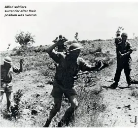  ??  ?? Allied soldiers surrender after their position was overrun