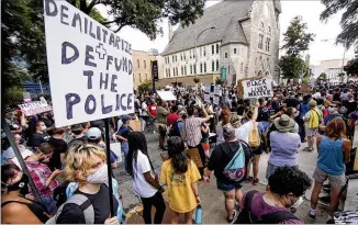  ?? STEVE SCHAEFER / FOR THE AJC ?? Demonstrat­ors marched Monday to the state Capitol in downtown Atlanta, many of them protesting incidents of police brutality against Black people. The killing of Rayshard Brooks by police the weekend before at an Atlanta Wendy’s parking lot swelled the crowd demanding reform.